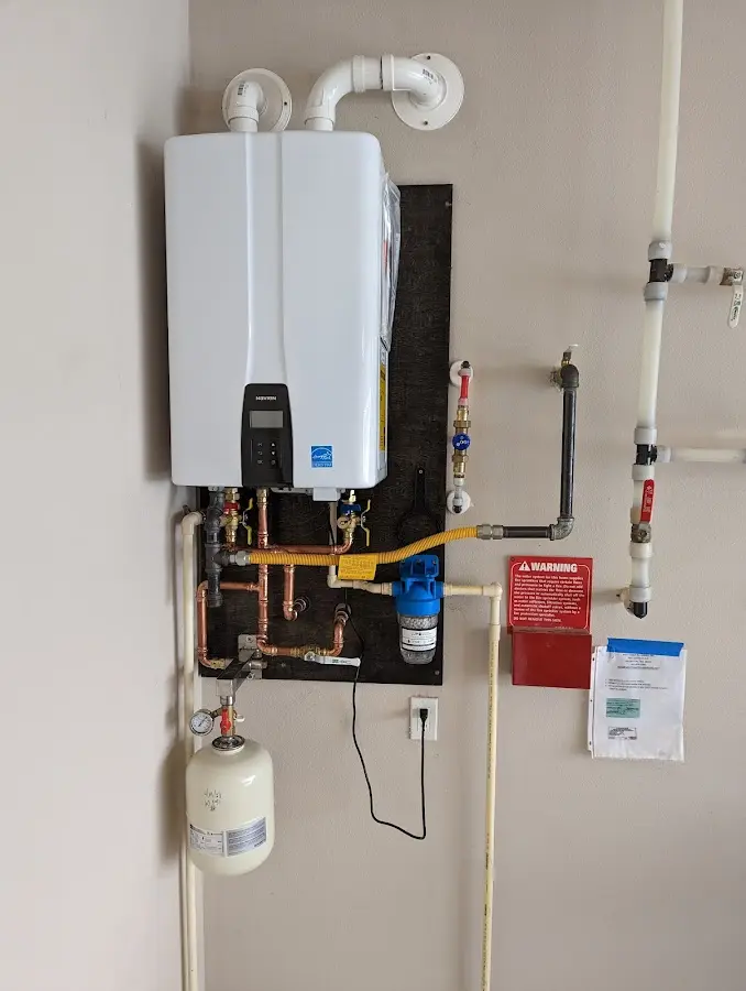 Professional plumber installing copper piping in a Chackbay home